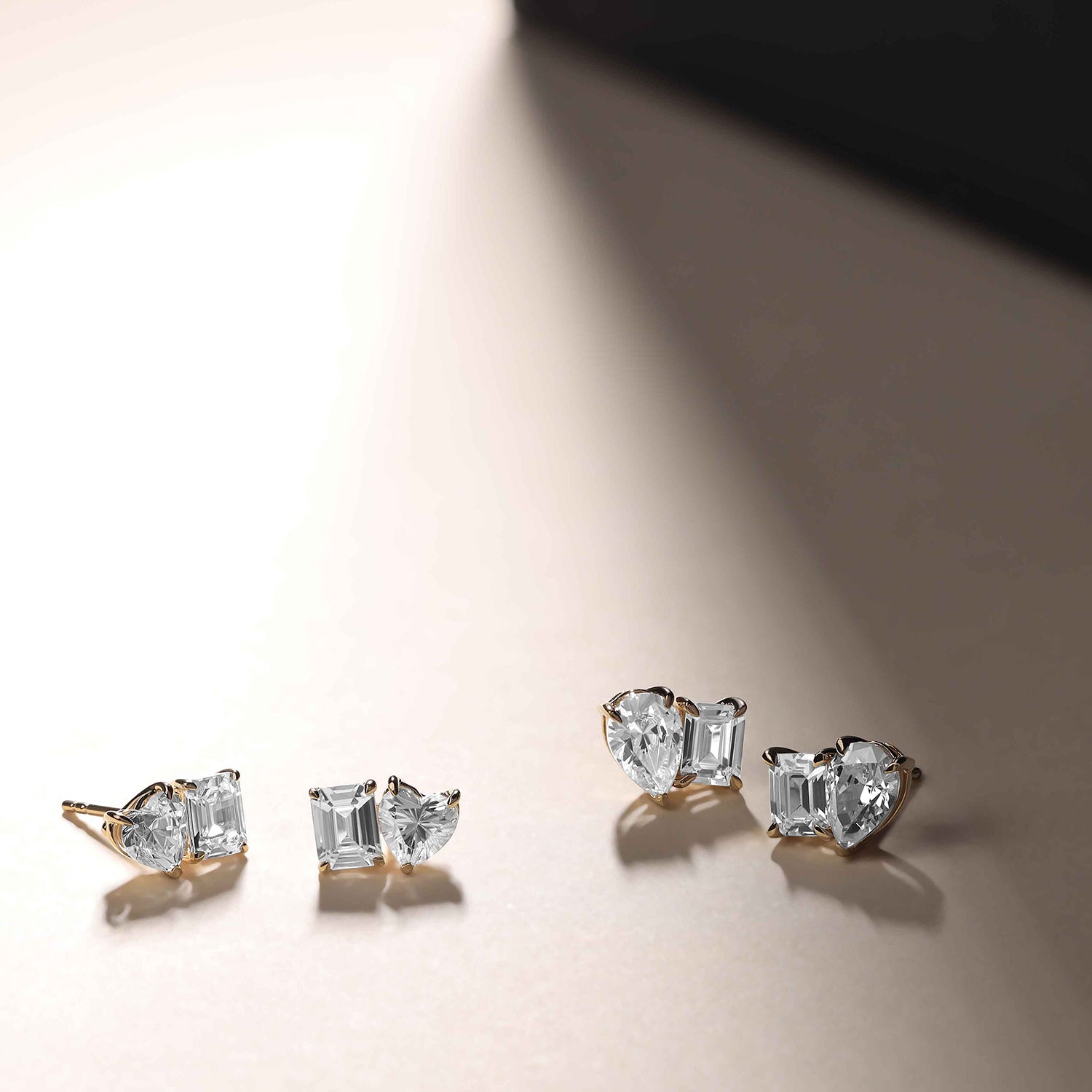 Atmos Heart Emerald Diamond Two Stone Studs_Product angle _PCP Main Image