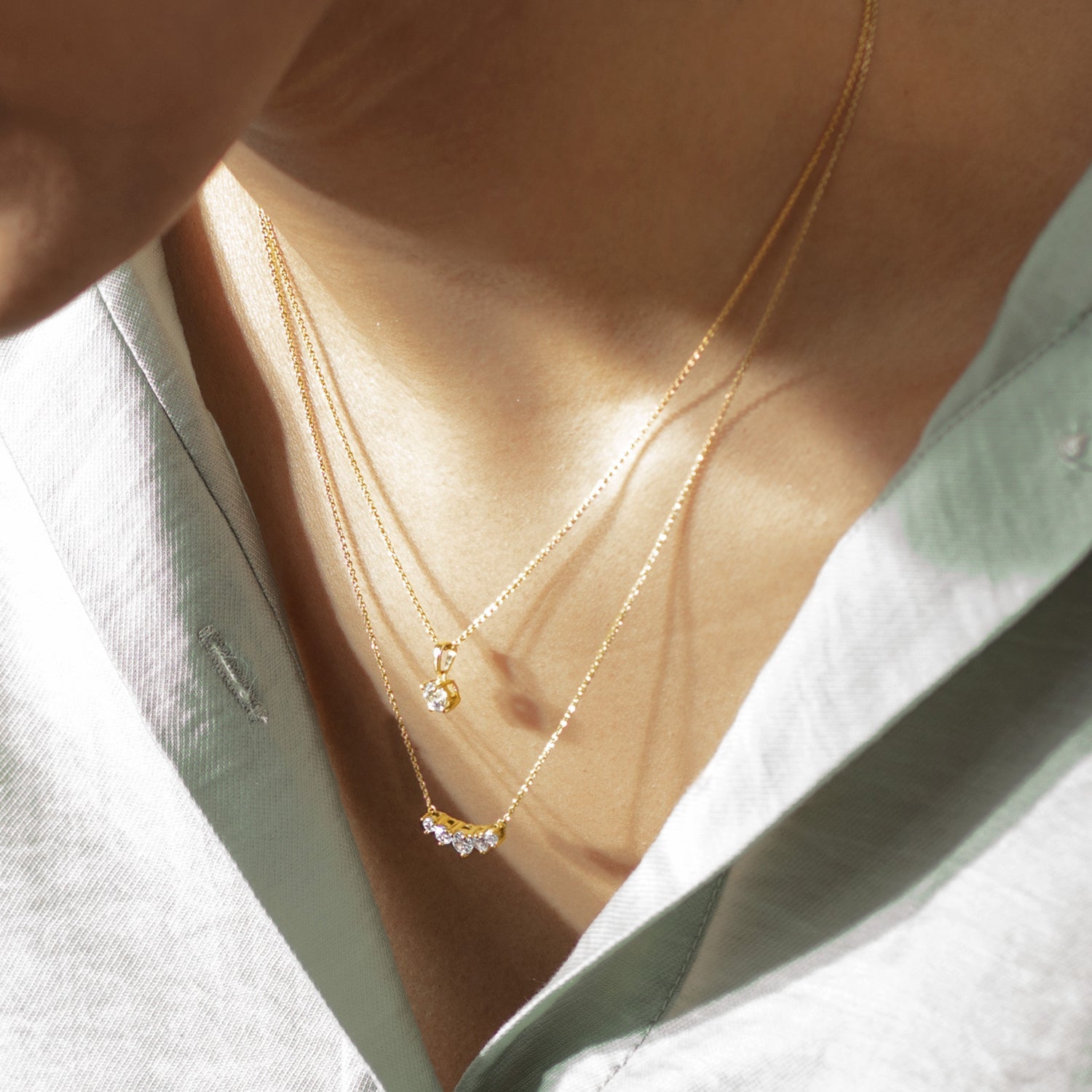 5-Stone Atmos Diamond Necklace_Product Angle_Lifestyle Image