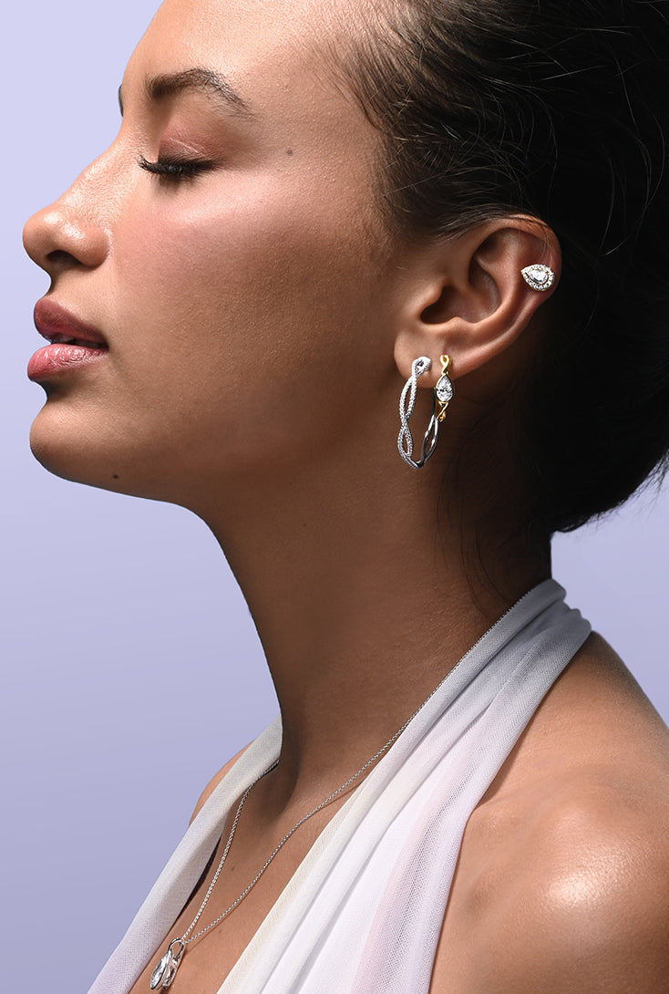 Diamond Earrings
Discover our stunning collection of diamond studs, danglers, and hoops featuring both lab-grown and natural diamonds. From classic to versatile styles, find the earring that matches your style.